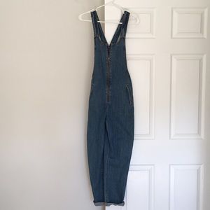 Denim overalls.